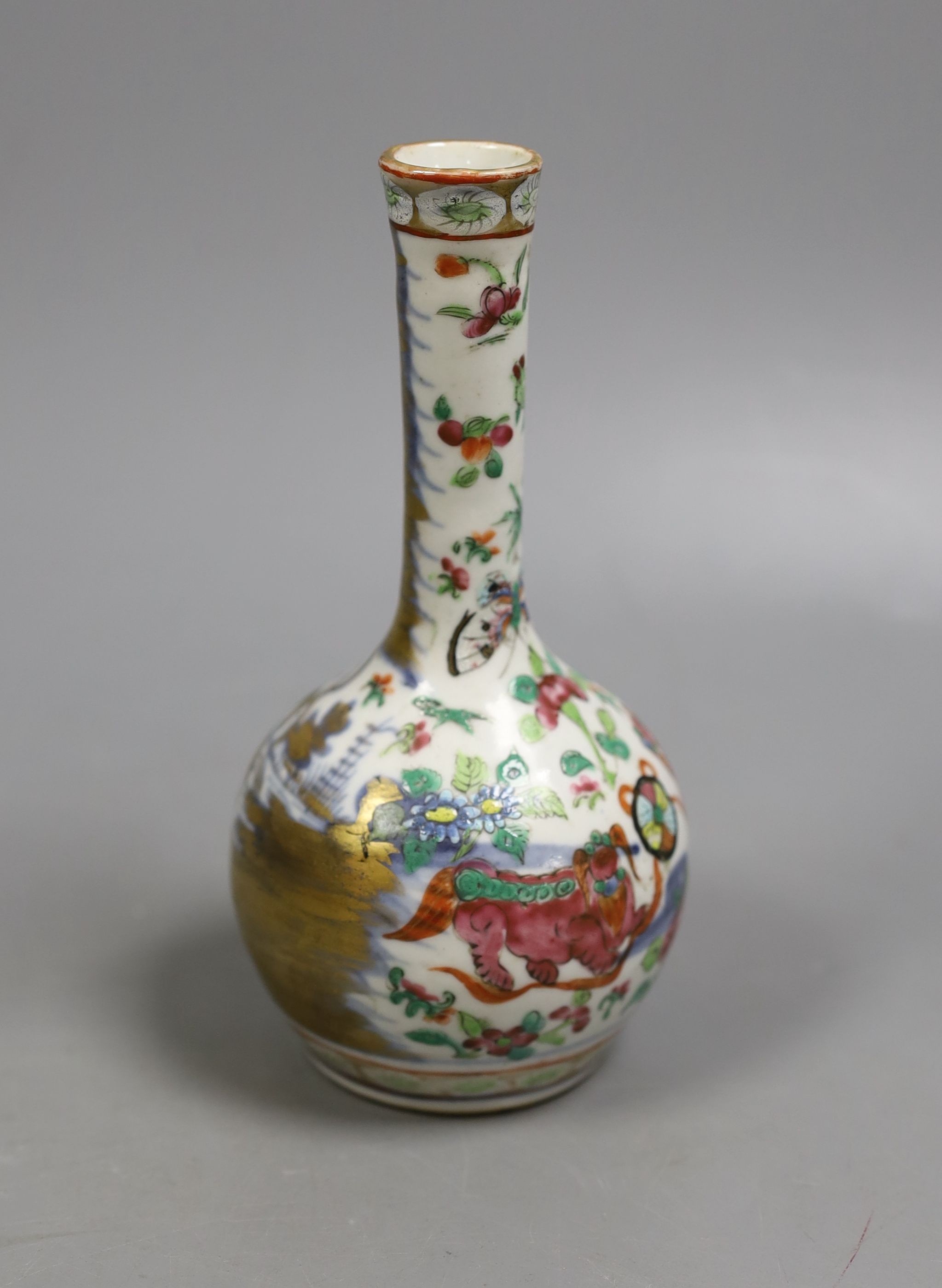 A 19th century Chinese famille rose bottle vase (dogs of fo), 17 cms high.